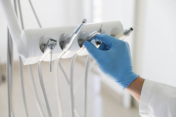 Professional Tooth Extraction technician working in Los Gatos, CA